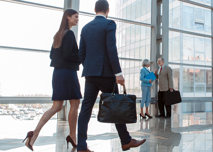 People walking in office lobby